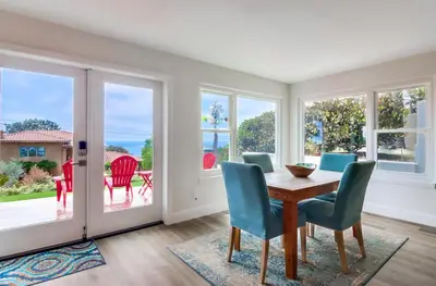 a dining room with a table and chairs at Oceanview Suite Hilltop in San Diego