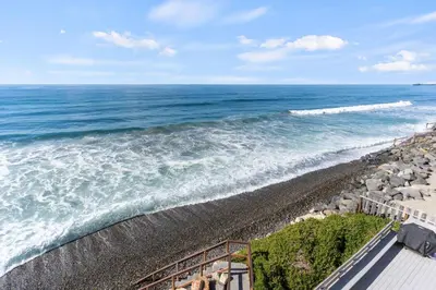 an overhead view of a beach with the ocean at 1317 S Pacific Unit B in Oceanside
