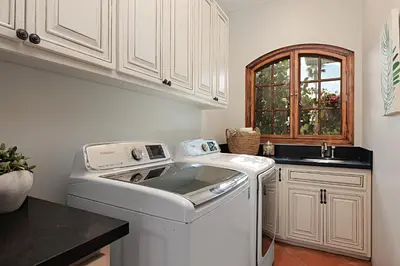 a kitchen with a washing machine and a sink at 5194 Carlsbad - Entire Home in Carlsbad