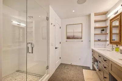 a bathroom with a shower and a sink at 597 S Sierra Avenue - Unit 69 in Solana Beach