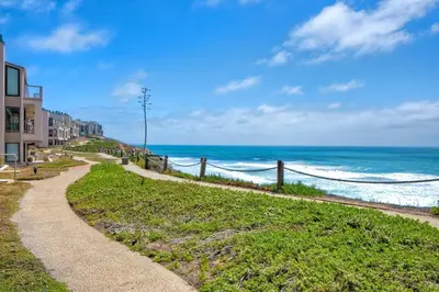 a path along a beach with the ocean in the background at 597 S Sierra Avenue - Unit 69 in Solana Beach