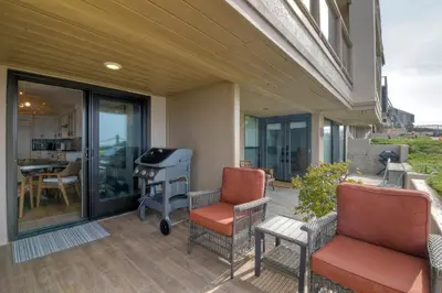 a patio with two chairs and a grill at 597 S Sierra Avenue - Unit 69 in Solana Beach