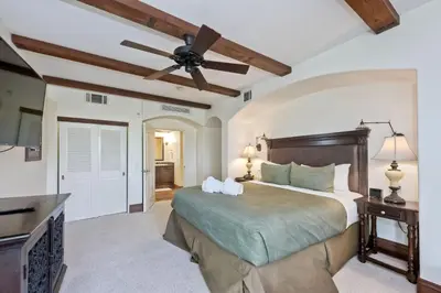 a bedroom with a bed and a ceiling fan at 7323 Estrella Del Mar Unit 6537 in Carlsbad