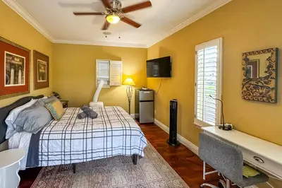 a bedroom with a bed and a ceiling fan at 9 Mi to Beach Pet-Friendly Apt in San Diego! in San Diego