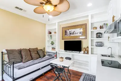 a living room with a couch and a tv at 9 Mi to Beach Pet-Friendly Apt in San Diego! in San Diego