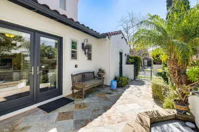 a patio with a bench next to a house at 9 Mi to Beach Pet-Friendly Apt in San Diego! in San Diego