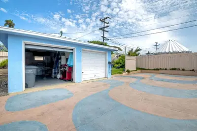 a house with a garage and a driveway at 165 n 167 Tamarack in Carlsbad