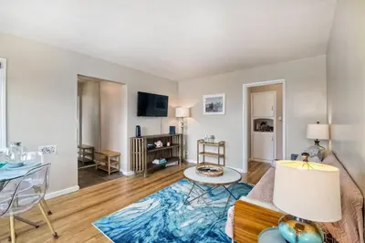 a living room with a couch and a table at 165 n 167 Tamarack in Carlsbad