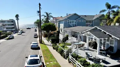 a row of houses on a street with cars parked at 180 n 190 Walnut Entire Home in Carlsbad