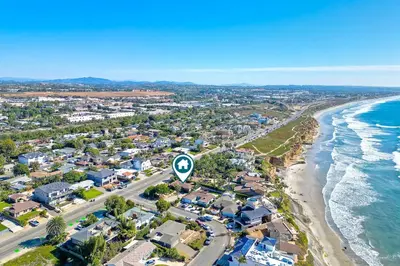 an aerial view of a beach with houses and the ocean at 5285 Shore Drive in Carlsbad