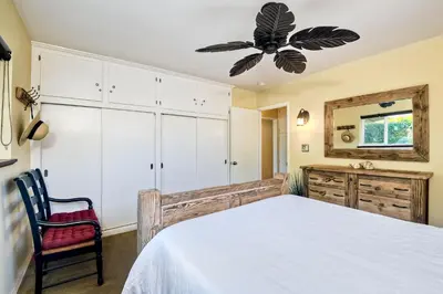 a bedroom with a bed and a ceiling fan at 5285 Shore Drive in Carlsbad