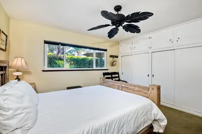 a bedroom with a bed and a ceiling fan at 5285 Shore Drive in Carlsbad