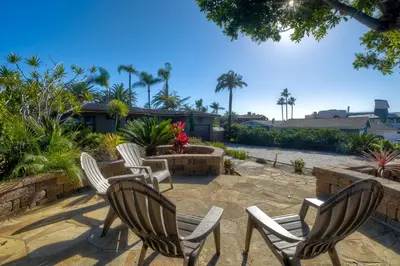 three chairs and a table on a patio at 5285 Shore Drive in Carlsbad
