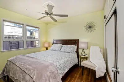 a bedroom with a bed and a ceiling fan at 167 Tamarack in Carlsbad