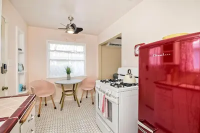 a kitchen with a white stove and a red refrigerator at 165 Tamarack in Carlsbad