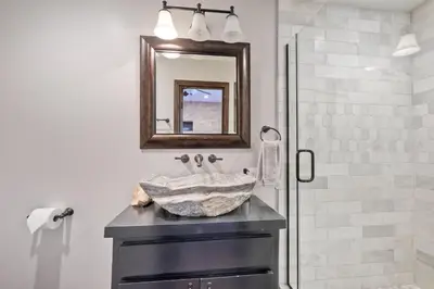 a bathroom with a sink and a mirror at 5194 Carlsbad Lower in Carlsbad