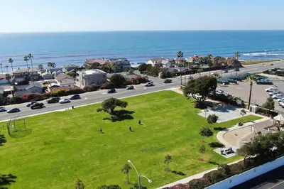 a park next to the ocean with people on the grass at 5194 Carlsbad Lower in Carlsbad