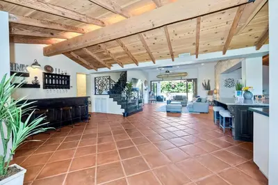 an open kitchen and living room with a wooden ceiling at 5194 Carlsbad Lower in Carlsbad