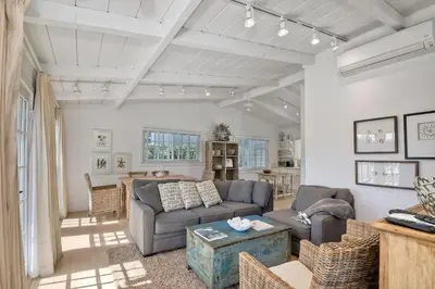 a living room with a couch and a table at 180 Walnut Upper in Carlsbad