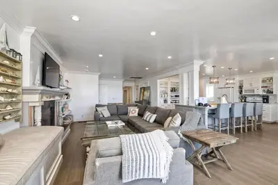 a living room with a couch and a table at 3636 Carlsbad Blvd - Lower in Carlsbad