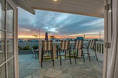 a porch with chairs and a view of the ocean at 3636 Carlsbad Blvd - Lower in Carlsbad