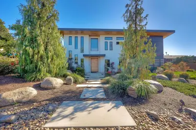 a house with trees in front of it at 253 E Jason Street in Encinitas