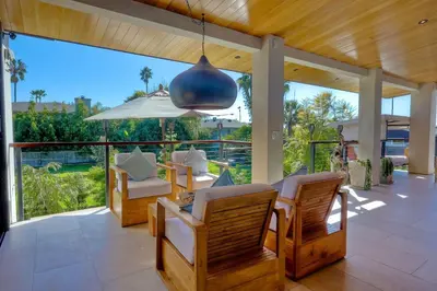 a patio with a table and chairs and a large window at 253 E Jason Street in Encinitas