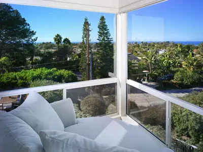 a living room with a white couch and a large window at 327 Hillcrest Drive in Encinitas