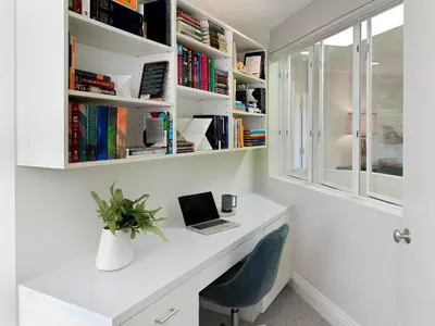 a white desk with a laptop and a chair at 327 Hillcrest Drive in Encinitas