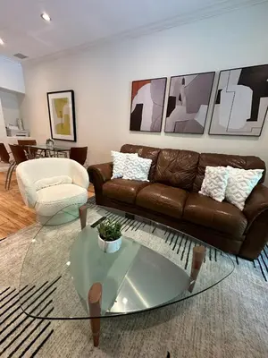 a living room with a couch and a glass table at Irvine Gem Luxury condo 31 days min near Irvine Business & UCI Hospital in Irvine
