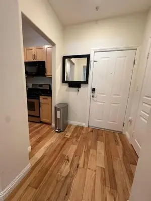 a room with a kitchen with a hard wood floor at Irvine Gem Luxury condo 31 days min near Irvine Business & UCI Hospital in Irvine