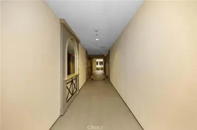 an empty hallway in a building with a ceiling at Irvine Gem Luxury condo 31 days min near Irvine Business & UCI Hospital in Irvine