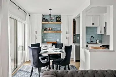 a kitchen and dining room with a table and chairs at Majestic Mermaid Retreat in San Diego