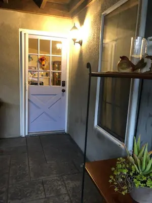 a door in a room with a table and a shelf at Family fun near the beach-sold in Oceanside