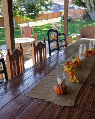 a wooden table with a pumpkin and candles on it at Family fun near the beach-sold in Oceanside