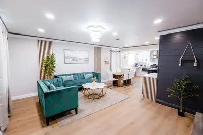 a living room with a couch and a table at Exotic home Cumberland street by sdstay in San Diego
