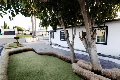 a house with a tree in the yard at Exotic home Cumberland street by sdstay in San Diego