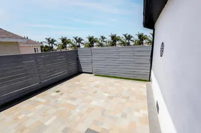 a balcony with a fence and a tile floor at Exotic home Cumberland street by sdstay in San Diego