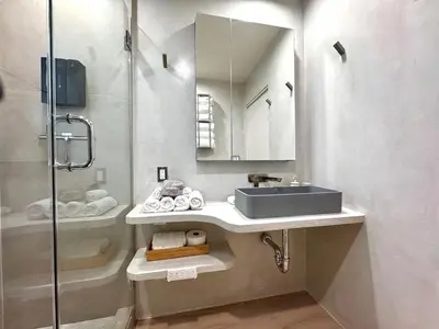 a bathroom with a sink and a shower at Titus Retreat in San Diego