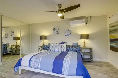 a bedroom with a bed and a ceiling fan at Bayside Retreat with Water Views Near Beach with AC and Private Patio in San Diego