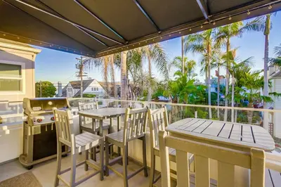 a patio with tables and chairs and a grill at Bayside Retreat with Water Views Near Beach with AC and Private Patio in San Diego