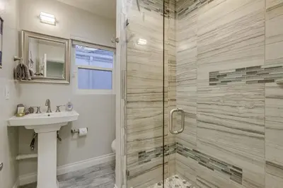 a bathroom with a shower and a sink at Bayside Retreat with Water Views Near Beach with AC and Private Patio in San Diego