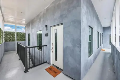 a hallway of a house with a white door at Harborside Suite 10 with Hot Tub and King Bed in San Diego