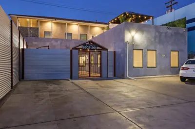 a building with a garage door in a parking lot at Harborside Suite 10 with Hot Tub and King Bed in San Diego