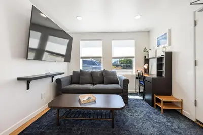 a living room with a couch and a table at Harborside Suite 08 with Hot Tub in San Diego