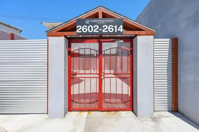 a red door with a sign on top of it at Harborside Suite 04 with Hot Tub and King Bed in San Diego