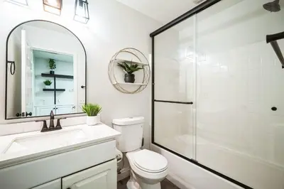 a bathroom with a toilet and a sink and a shower at Carroll Family Retreat in San Jacinto