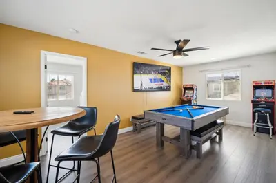 a billiard room with a table and ping pong ball at Carroll Family Retreat in San Jacinto