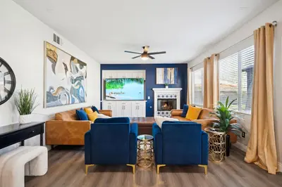 a living room with a couch and a table at Carroll Family Retreat in San Jacinto