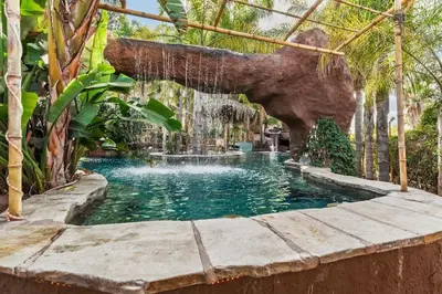 a swimming pool with an elephant in the middle of it at Paradise Lagoon Resort Style Pool Getaway in La Mesa
